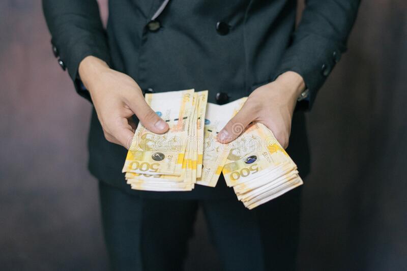 successful-business-wearing-suit-counting-lot-philippines-money-banknotes-cash-hand-portrait-man-philippine-success-193814583
