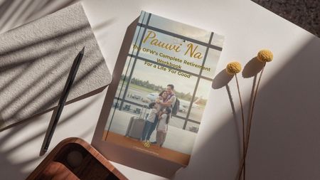 An overseas Filipino worker writing in the Pauwi Na Workbook for retirement planning